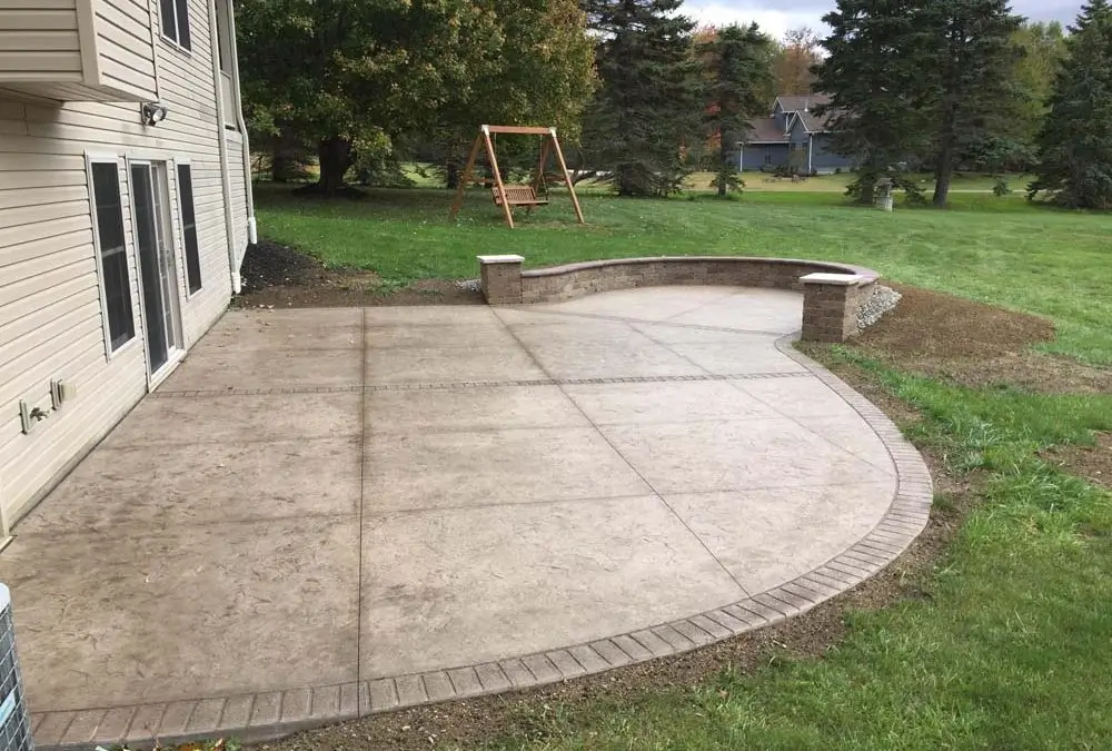 A high-quality stamped concrete patio by Concrete Invercargill, featuring a natural stone-like texture for an elegant and long-lasting outdoor area.