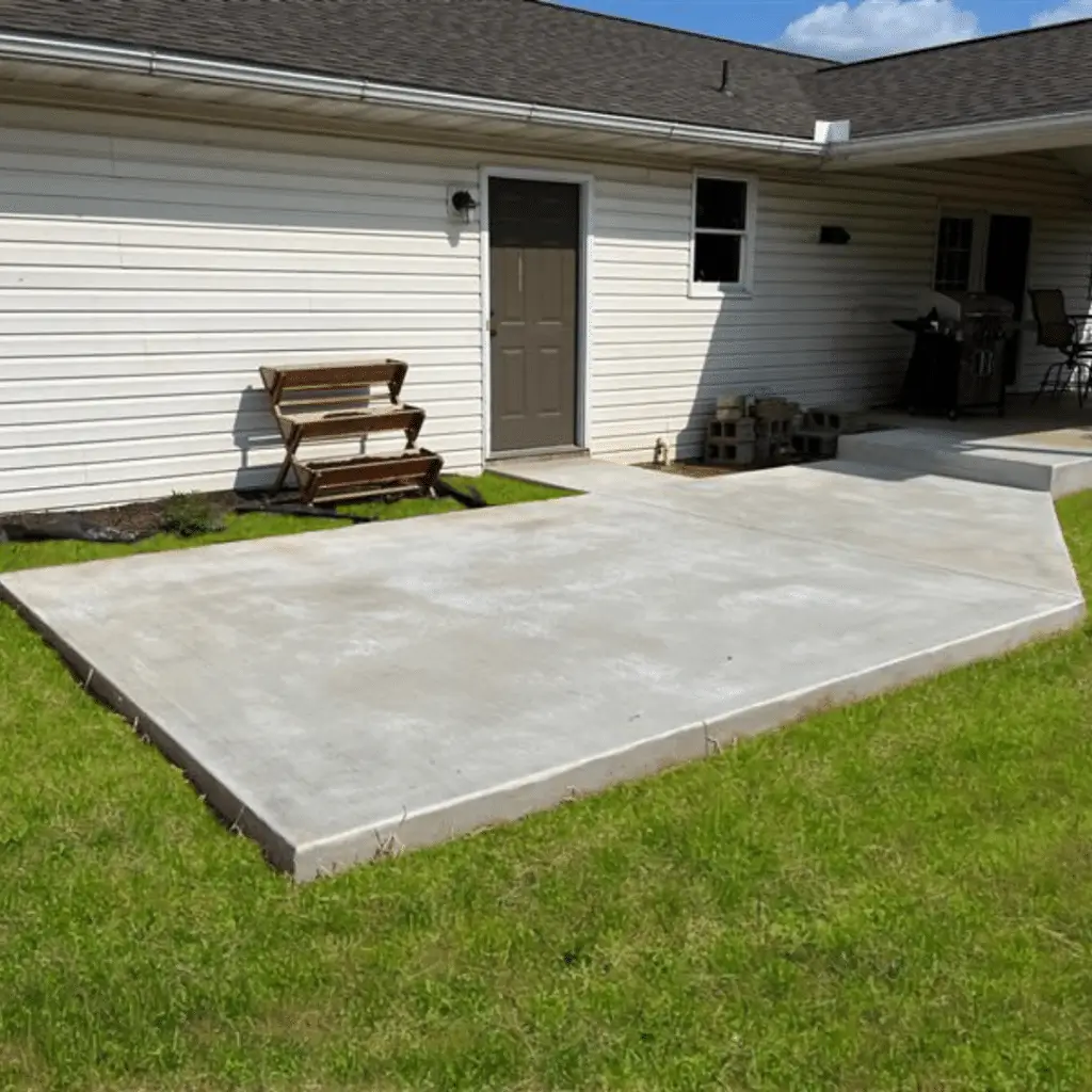 Durable concrete patio adjacent to a home, a functional and stylish addition by Concrete Invercargill.